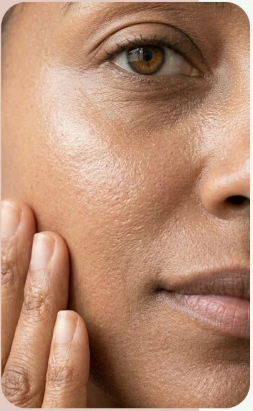 Close-up of a woman touching her cheek