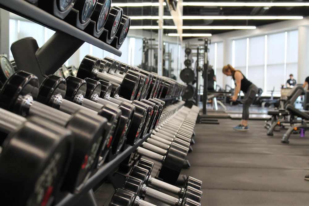 Exercise equipment in a sunlit fitness studio